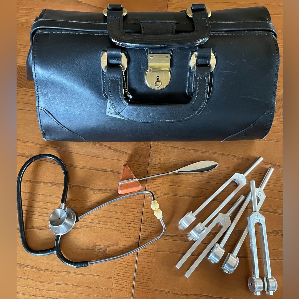 Schlesinger vintage black leather Dr. bag with lock, keys and medical tools.